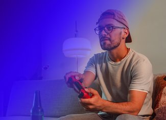 A person playing a video game using a controller