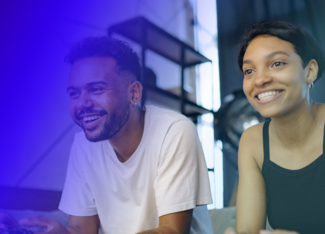a girl and a boy smiling and playing video games 