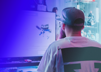 a man playing a video game at his gaming computer